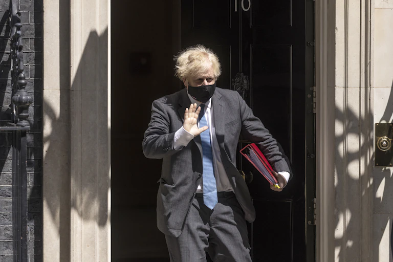 Boris Johnson wearing face mask leaving No 10 Downing St