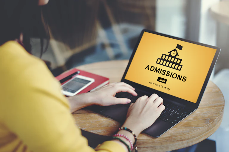 Young woman completes university admission application online
