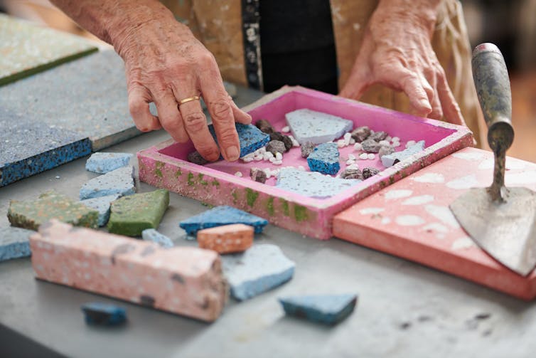 woman making terrazzo tile