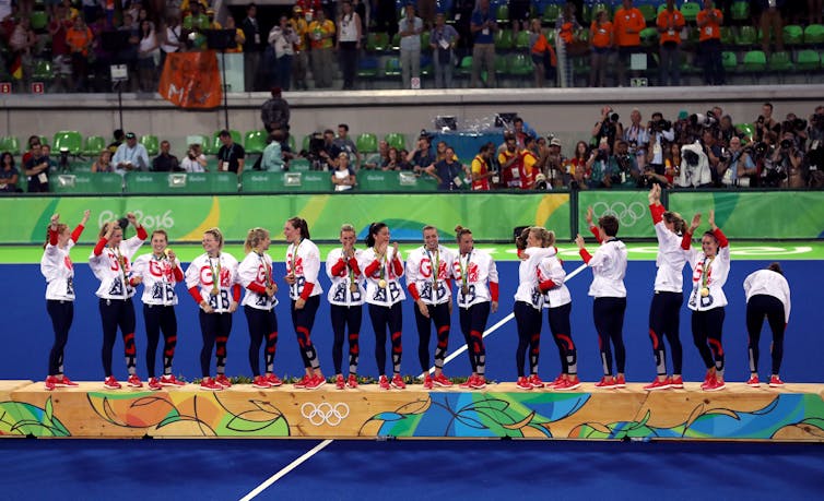 The Team GB women's hockey players celebrate their win on the podium at the Rio 2016 Games