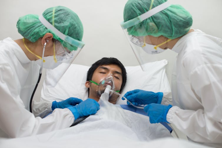 A COVID patient being treated
