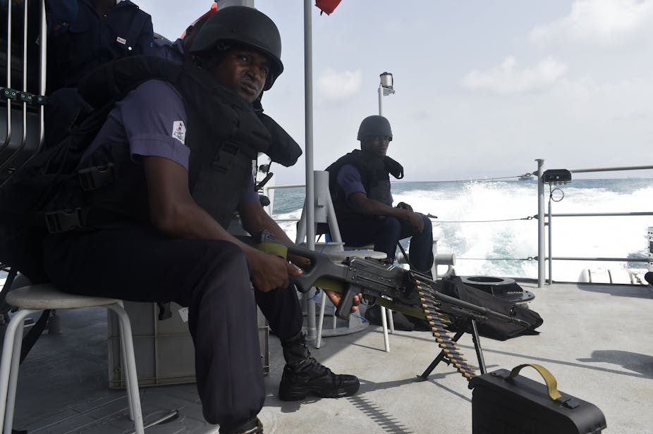 Nigerian naval members sit in a vessel during Obangame Express, a multinational maritime exercise involving 33 countries off the coast of Lagos on March 20, 2019.