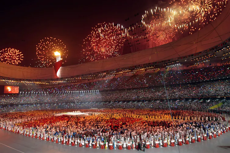 Fireworks explode over a stadium.