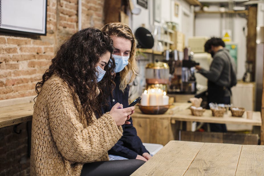 Couple wears masks indoors