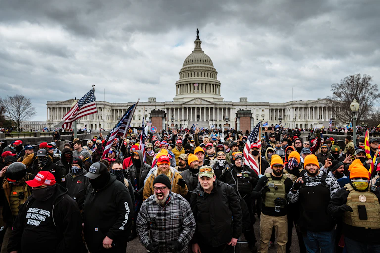A group of angry people rallying in front of the US Capitol on January 6, 2021.