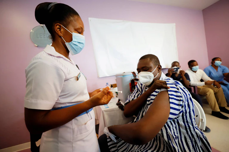 A nurse vaccinates a patient