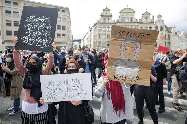 Participants at a rally for the right to wear a hijab in Brussels universities
