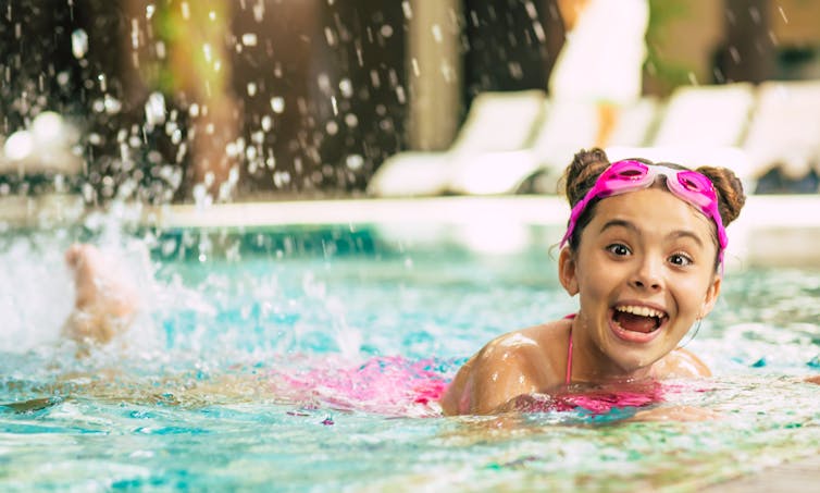 Smiling child in swimming pool