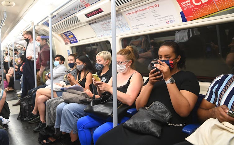 People on the London underground wearing masks