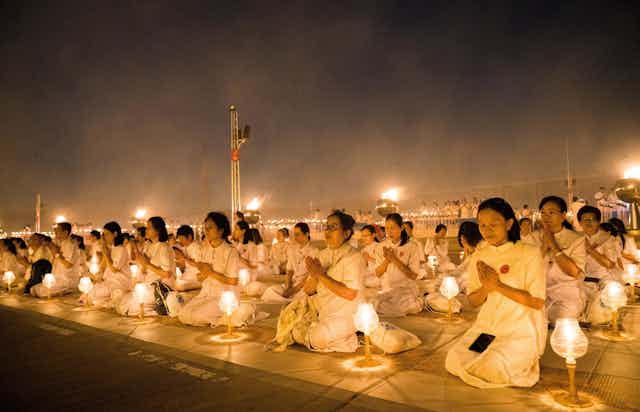 Buddhist devotees seen meditating with their lanterns at the Dhammakaya Temple in Bangkok during the yearly Makha Bucha ceremony, one of the most important day for Buddhists around the world.