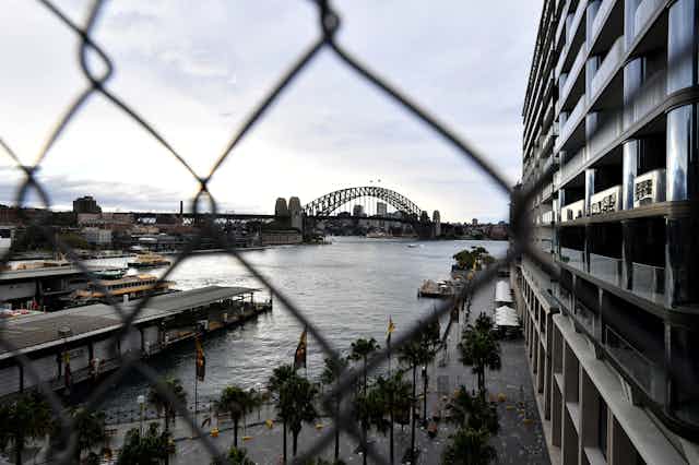 The Sydney Harbour Bridge behind wire fencing