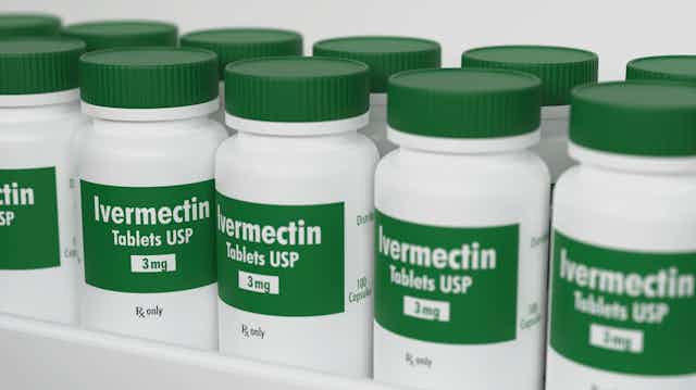 Rows of ivermectin bottles on a shelf