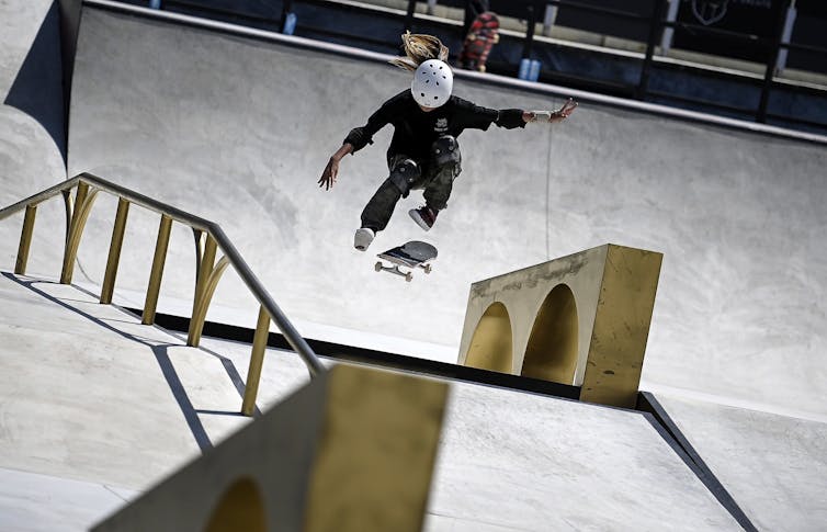 A woman competes in a pre-Olympic skateboarding competition.