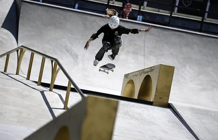 A woman competes in a pre-Olympic skateboarding competition.