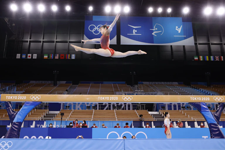 Aiko Sugihara (top) of Japan practices for the Tokyo Olympics on July 22, 2021, at Ariake Gymnastics Centre.