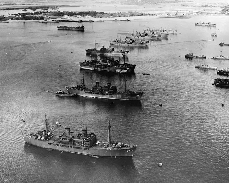 Black and white image showing anchored ships.