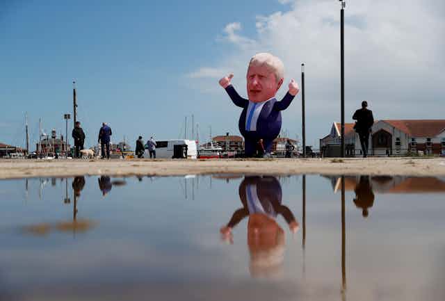 An inflatable balloon in the shape of Boris Johnson hovering on a street in Hartlepool. 