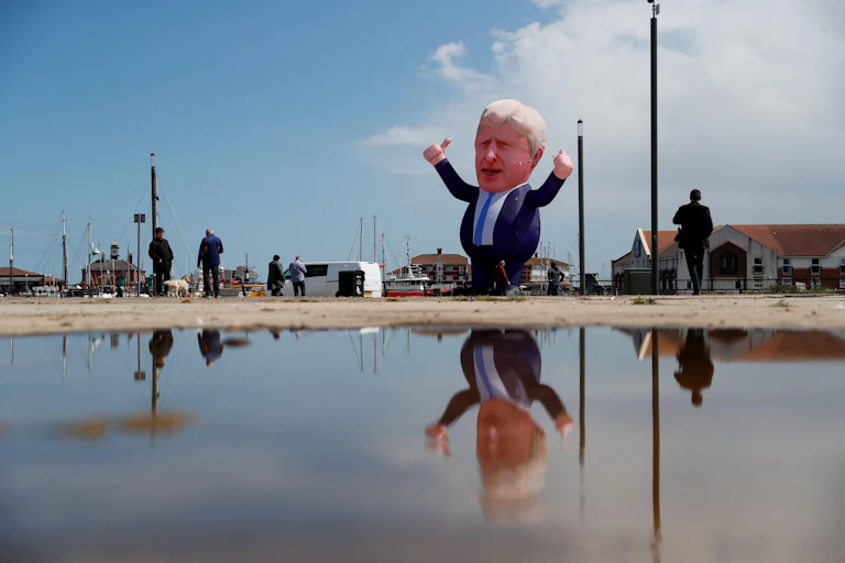 An inflatable balloon in the shape of Boris Johnson hovering on a street in Hartlepool.