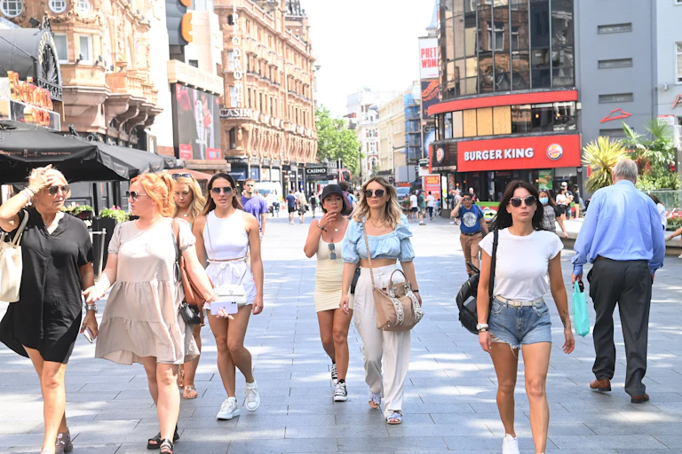 People walking through Leicester Square in London