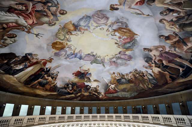 The ceiling of the US Capitol's rotunda shows a fresco depicting George Washington rising to the heavens with various gods and other figures around him