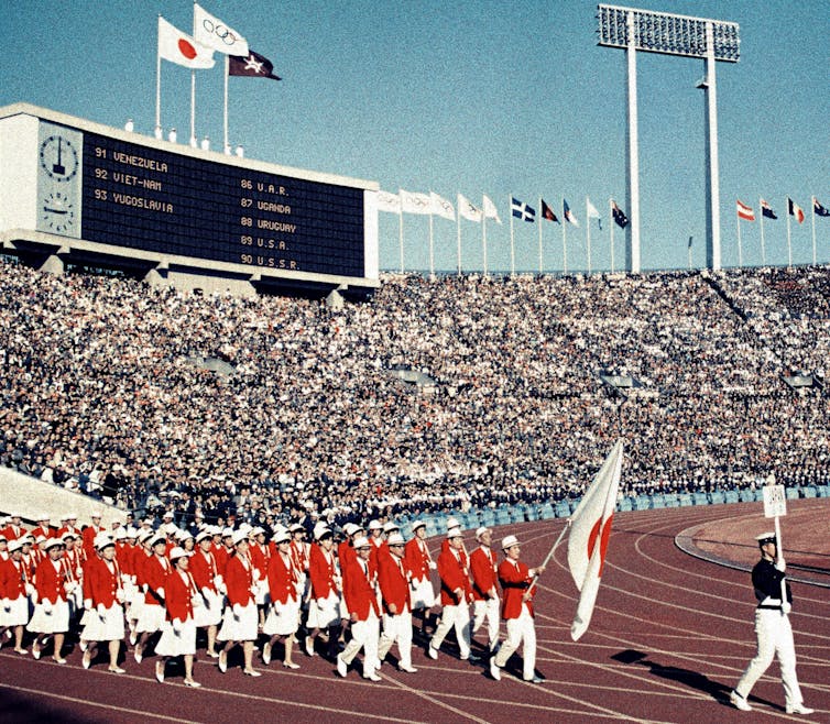 Japanese athletes march at National Stadium during the Tokyo Olympics opening ceremony