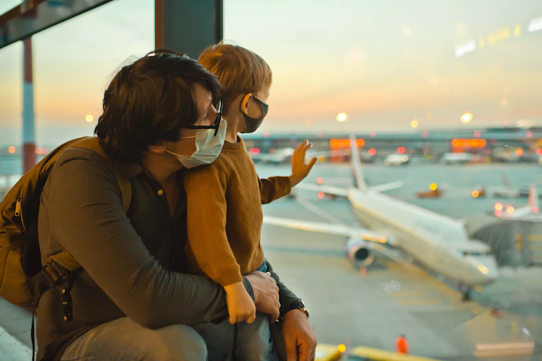 Family in masks in airport