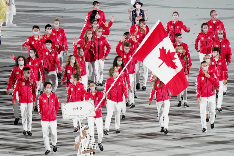 A small group of Canadian athletes march in the opening ceremonies.