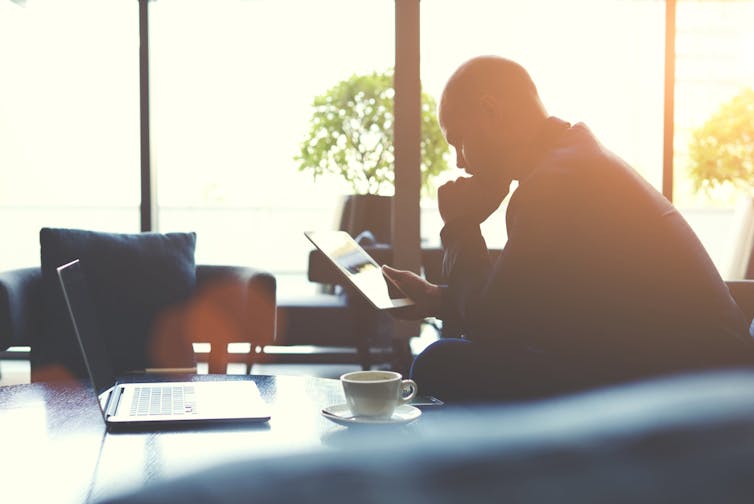 Silhouette of a company director at his desk