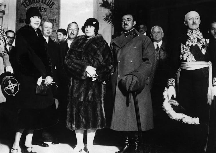 King Amanullah Khan and Queen Soraya Tarzi Hanim arrive at a railway station.