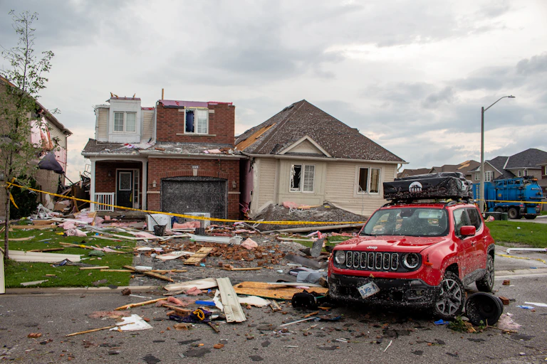 A photo of a front yard showing tornado damage
