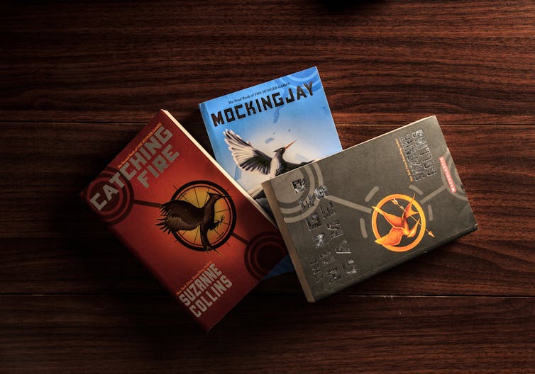 Cover of three books from the Hunger Games series