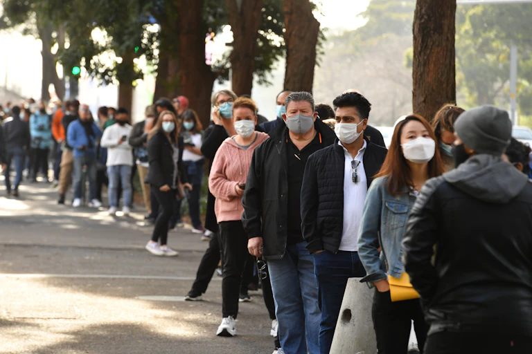 People queue to receive a COVID vaccine in Sydney.