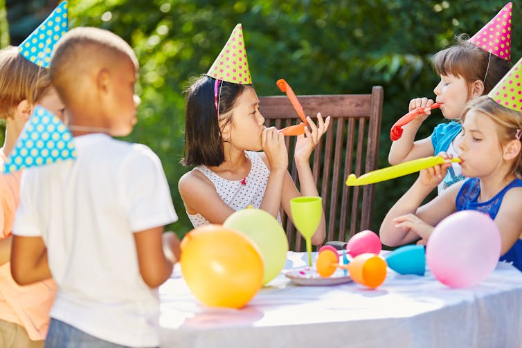 Children celebrate at a birthday party.