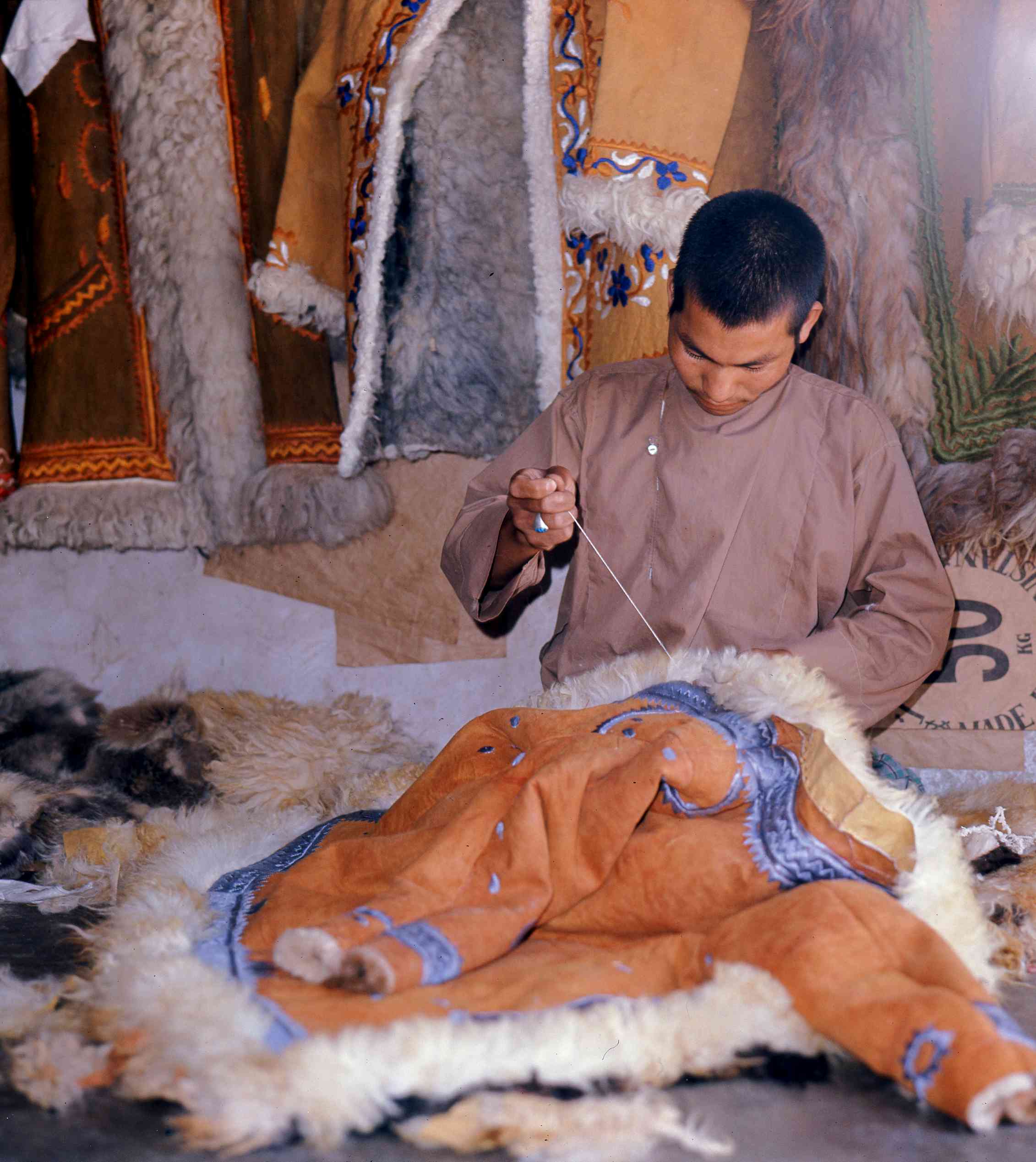 boy makes afghan coat