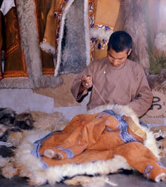 boy makes afghan coat