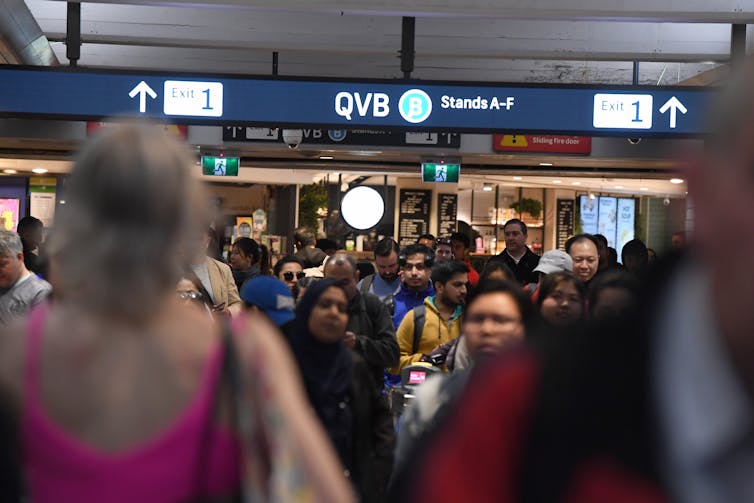 Commuters crowd into Town Hall station in Sydney.