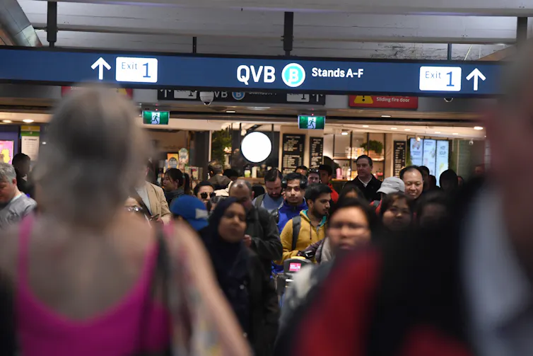 Commuters crowd into Town Hall station in Sydney.