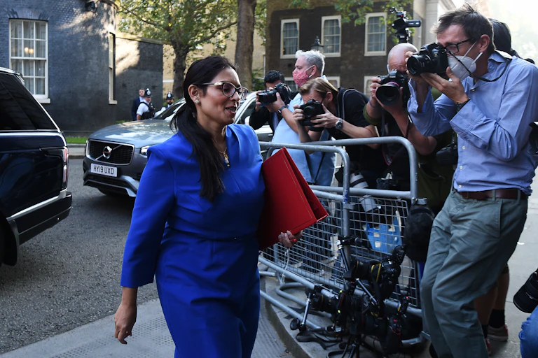 Home Secretary Priti Patel walks into Downing Street past a group of photographers
