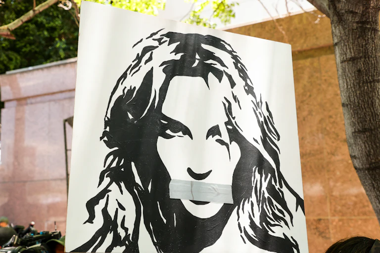 Poster of Britney Spears with duct tape over her mouth.