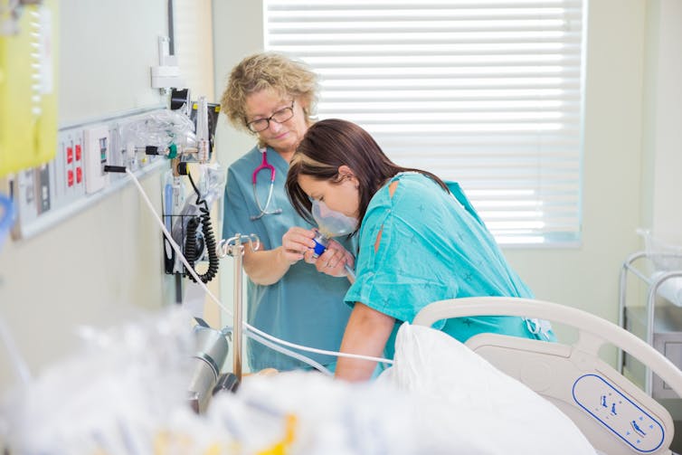 A woman receives nitrous oxide for pain relief during labour.