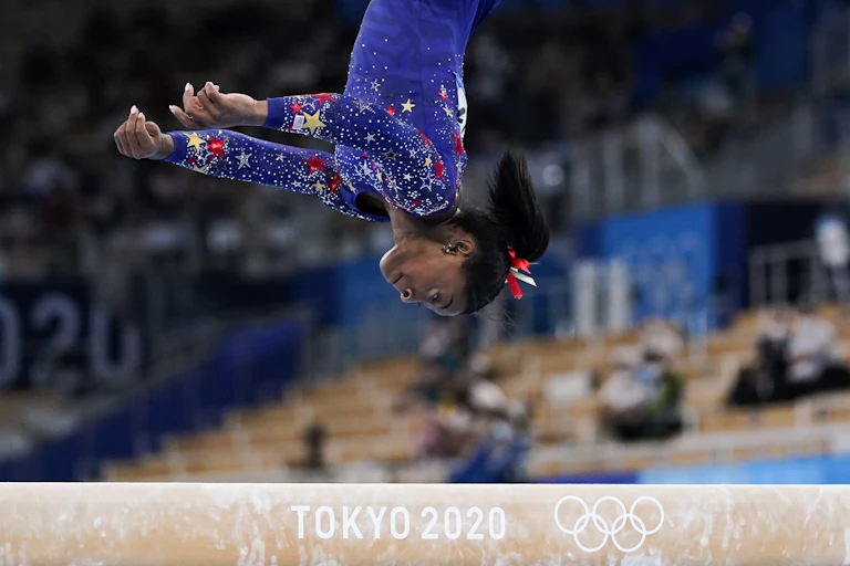 Gymnast Simone Biles midway through a somersault