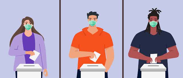 Three people cast votes while wearing face masks.