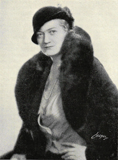 Black and white picture of a woman in a fur coat.