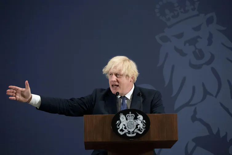 Boris Johnson making a speech at a podium