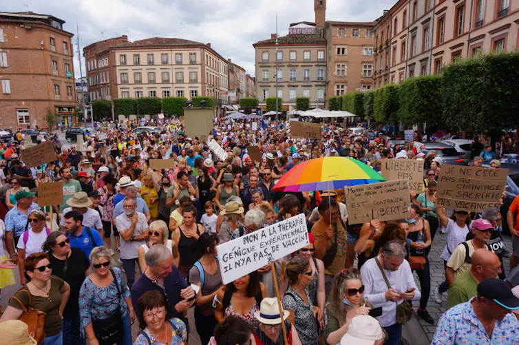 People protest France’s new health pass in Albi, southern France