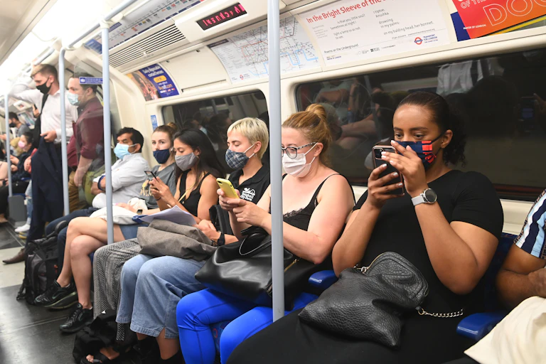 Commuters wearing masks on the London Underground