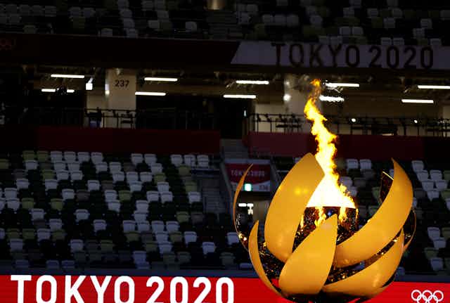 A picture shows the Olympic Flame and Cauldron during the opening ceremony of the Tokyo 2020 Olympic Games, at the Olympic Stadium, in Tokyo
