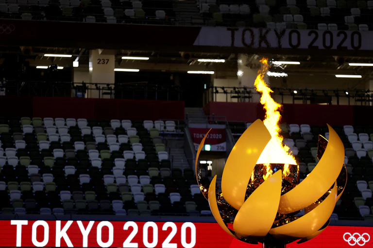 A picture shows the Olympic Flame and Cauldron during the opening ceremony of the Tokyo 2020 Olympic Games, at the Olympic Stadium, in Tokyo