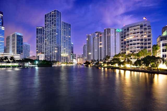 Dusk view of Miami towers along a bay and river