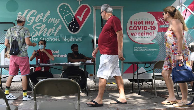 people at a mobile vaccination site